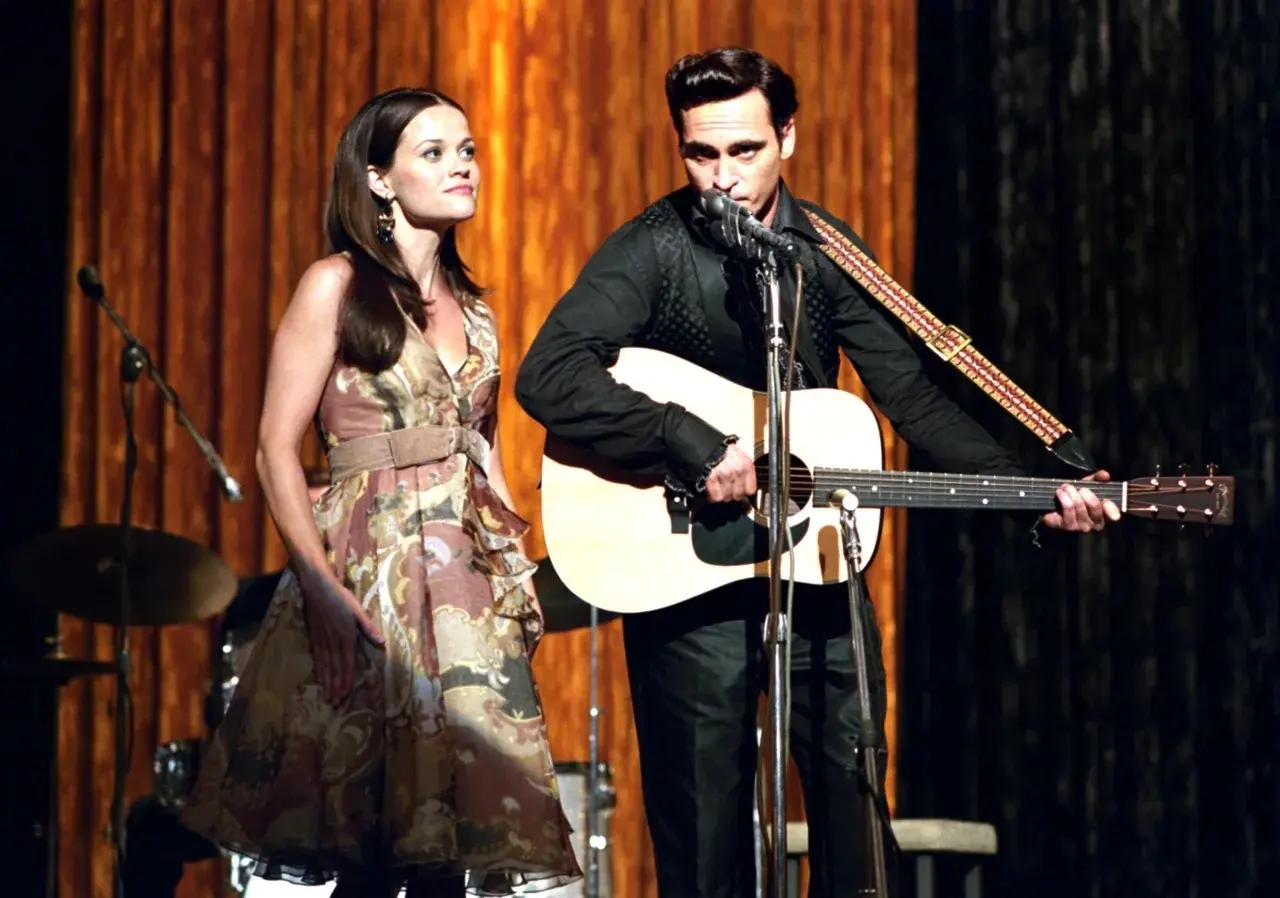 Walk The Line (2005)
The film offers an insight into Johnny Cash's childhood on a cotton farm, to his ascent to fame in the country music scene, as he begins a troubled relationship with June Carter. It stars Joaquin Phoenix and Reese Witherspoon
