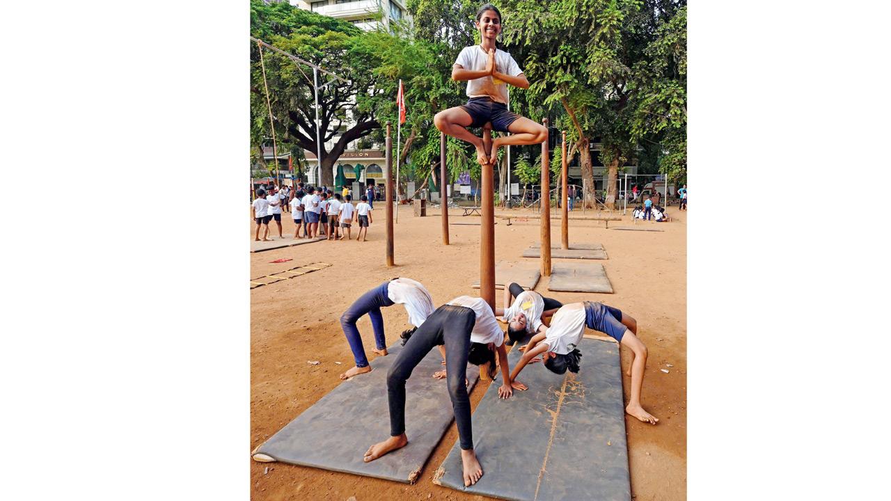 Children at Shree Samarth Vyayam Mandir learn balance and discipline through mallakhamb sessions at the 10-day training camp in Dadar