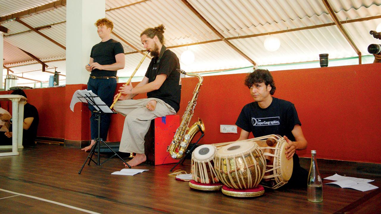 Jonathan Taikina Taylor (left) oversees a rehearsal session. PICS COURTESY/SuperGeographics