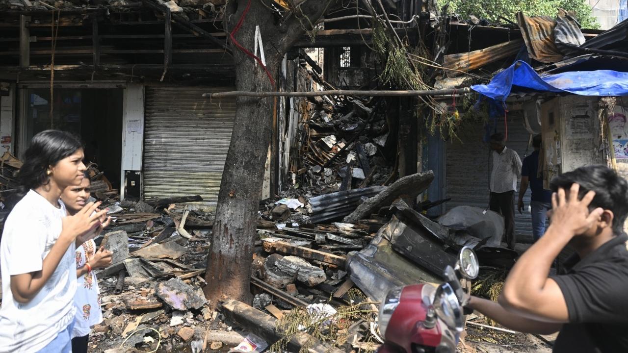 The fire was confined to electric wiring, installations and equipment in around five large and seven small shops spread over nearly 5,000 sq ft on the ground and first floors of the structure, a civic official said.