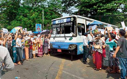 Relatives surround a bus carrying released prisoners. Pics/AFP