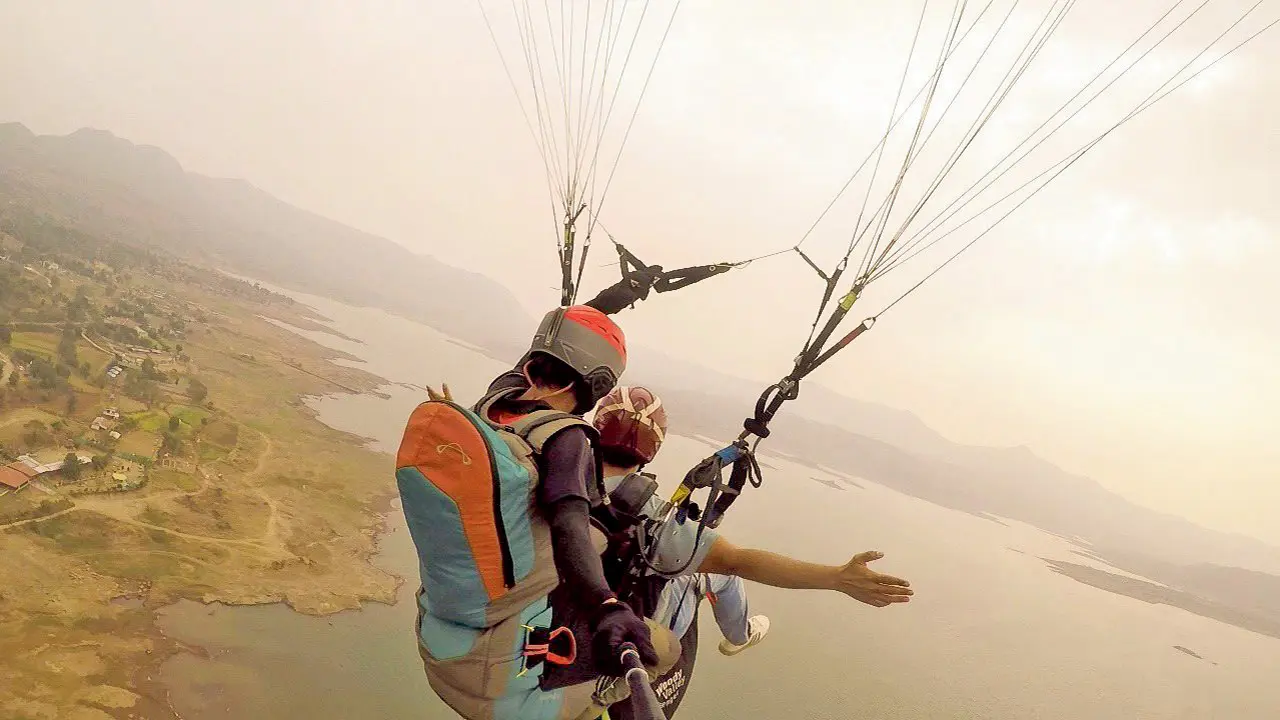 Participants paraglide over Pawna Lake.  PICS COURTESY/TEMPLE PILOTS