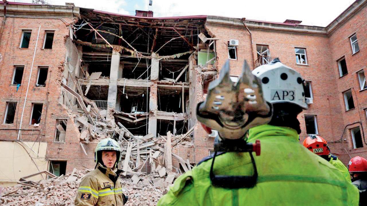 Rescuers at the site of a Russian attack on Dnipro. FILE PIC/AFP