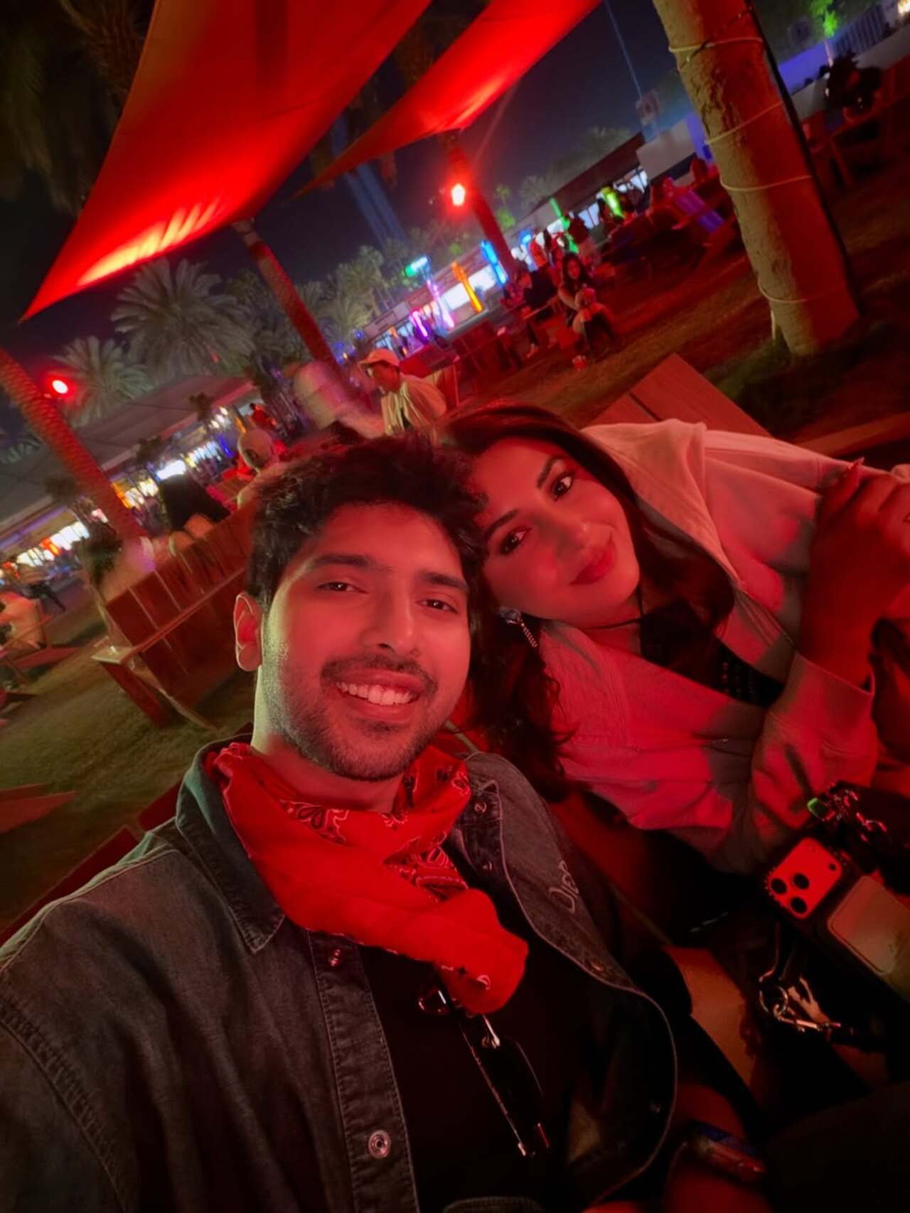 A night-time frame with a red bandana and jacket adds a moody contrast, showing a shift from day to after-dark aesthetics