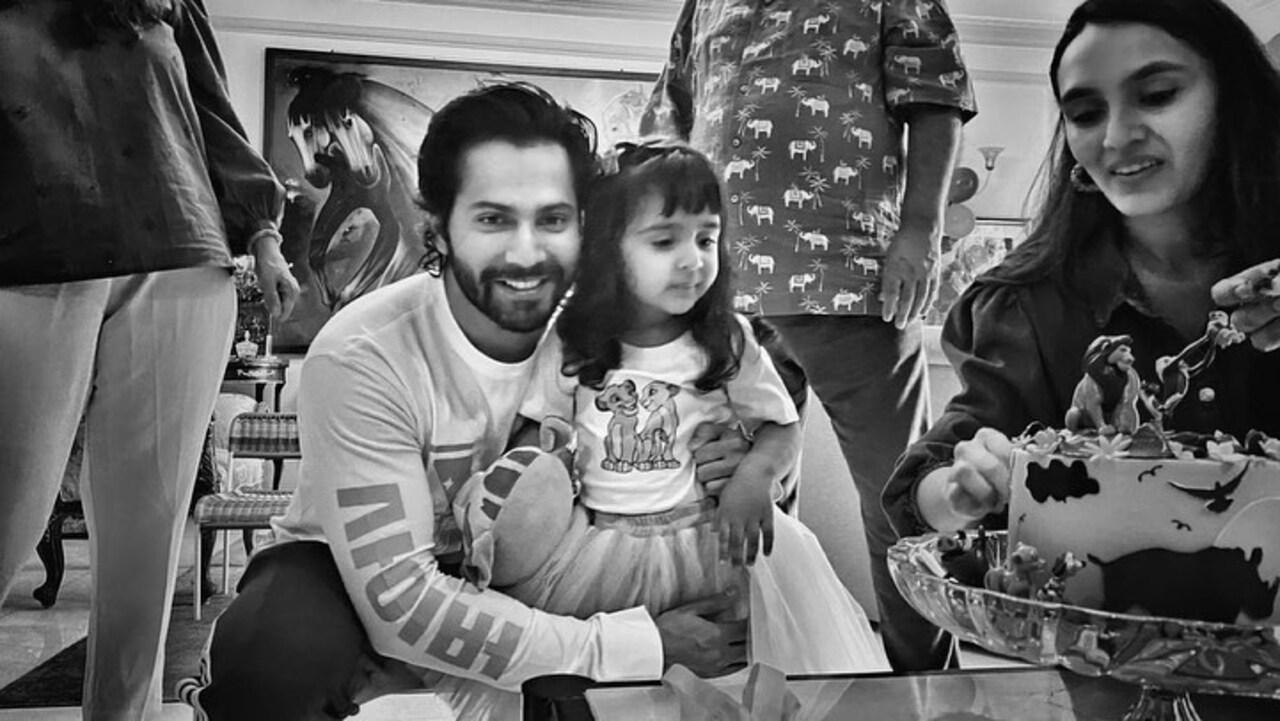 Varun Dhawan is seen sharing a sweet moment with his niece Niyara, posing closely with a warm smile. The candid picture captures their adorable bond.