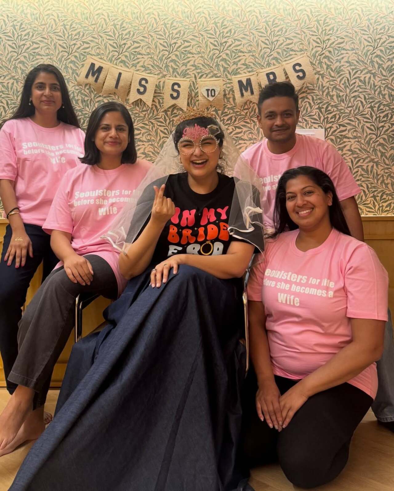 Another picture shows the bride-to-be posing with her cousins, all twinning in pink T-shirts, with a banner behind them that reads &ldquo;Miss to Mrs.&rdquo;