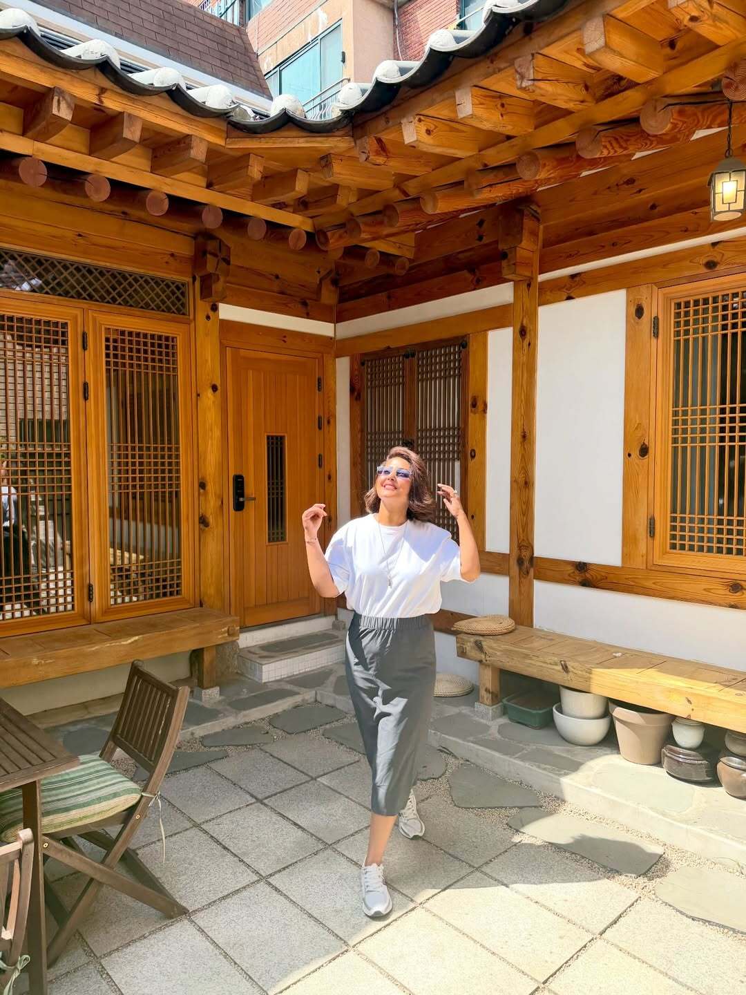 Hina Khan was seen soaking in the sun in a chic white top paired with a grey skirt, keeping her look minimal yet elegant.&nbsp;