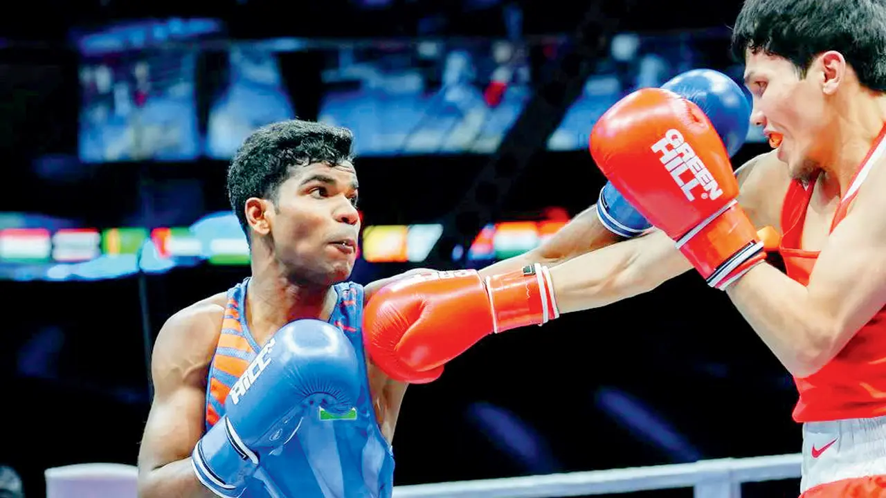 Boxer Suresh shocks world champ Sanzhar to enter semis