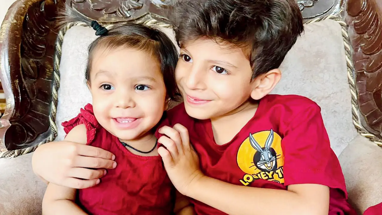 The child playing with her brother