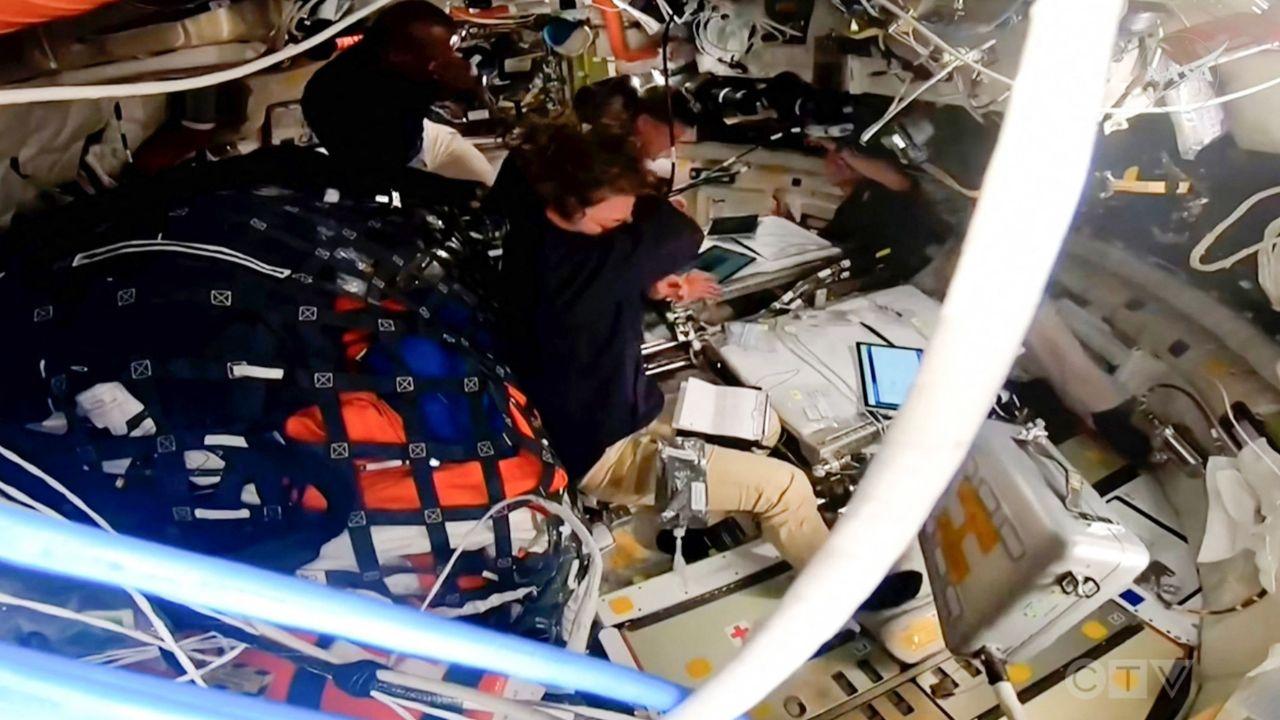 The Artemis II astronauts carried up with them the Apollo 8 silk patch that accompanied Lovell to the moon.