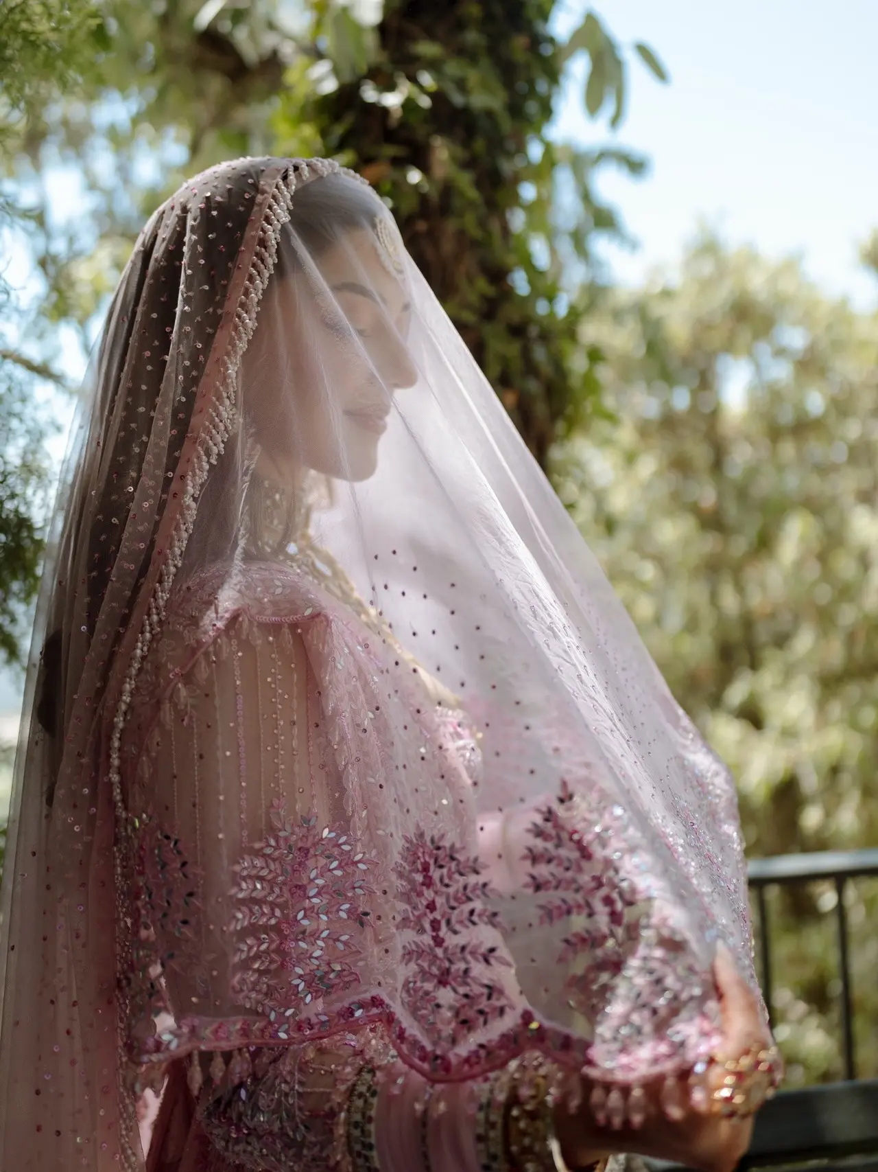 She left her hair open under a delicate veil, completing her graceful bridal look.&nbsp;