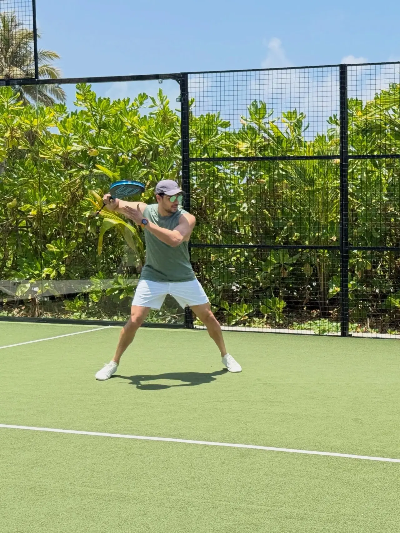 Sidharth Malhotra also enjoyed a game of padel tennis, wearing a casual olive green tank top, white shorts, a baseball cap, and sunglasses while on an outdoor padel court.&nbsp;
