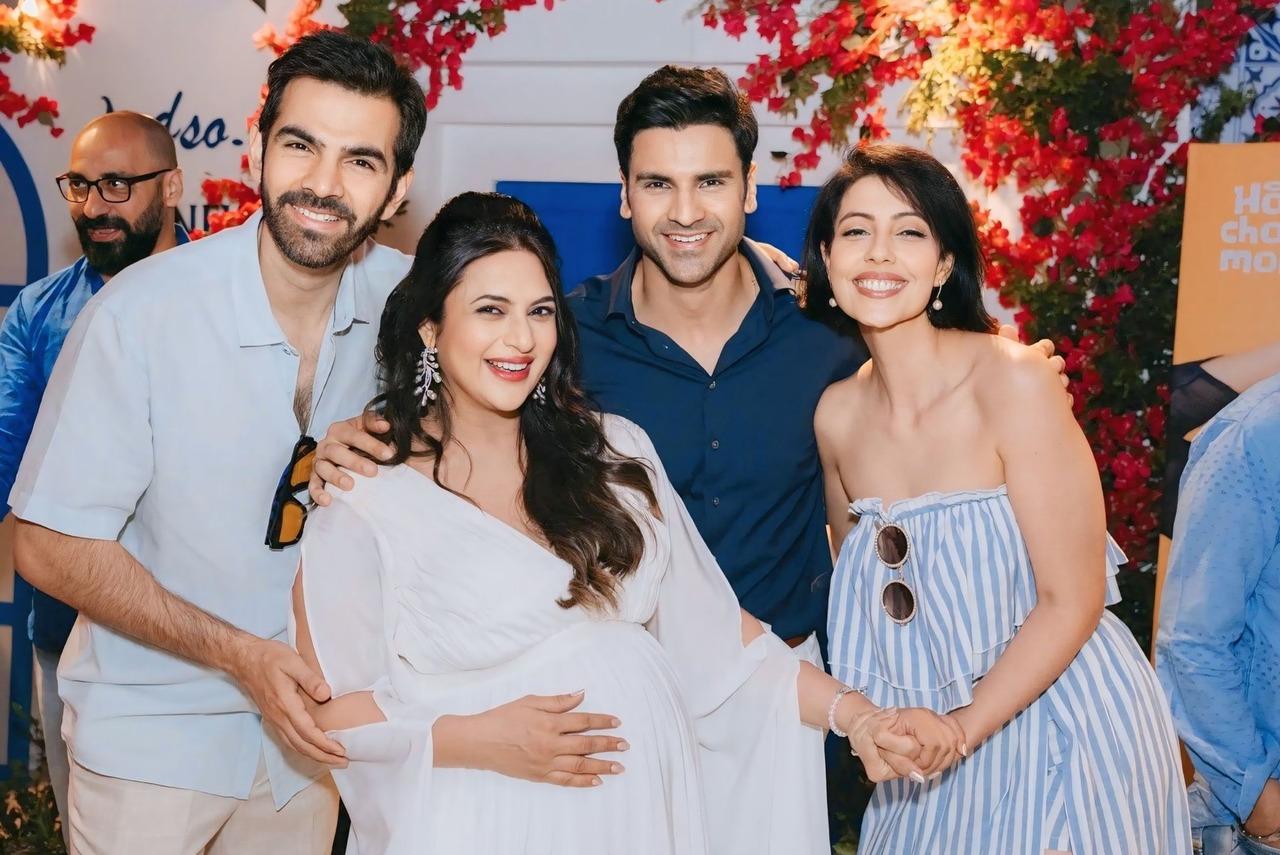 Karan V Grover and his wife Poppy Jabbal were seen posing with Vivek and Divyanka in one of the pictures.