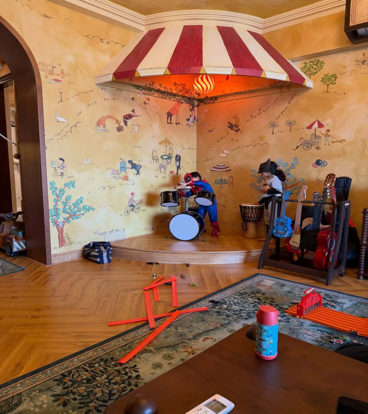 This adorable click shows little Vayu playing dress-up. The three-year-old is playing the drums in a Spiderman costume, alongside a friend who is wearing a Batman mask