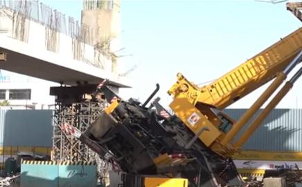Crane overturns during the early morning metro construction work at Bandra Kurla Complex (BKC). (Pic/Screengrab from X @PTI)