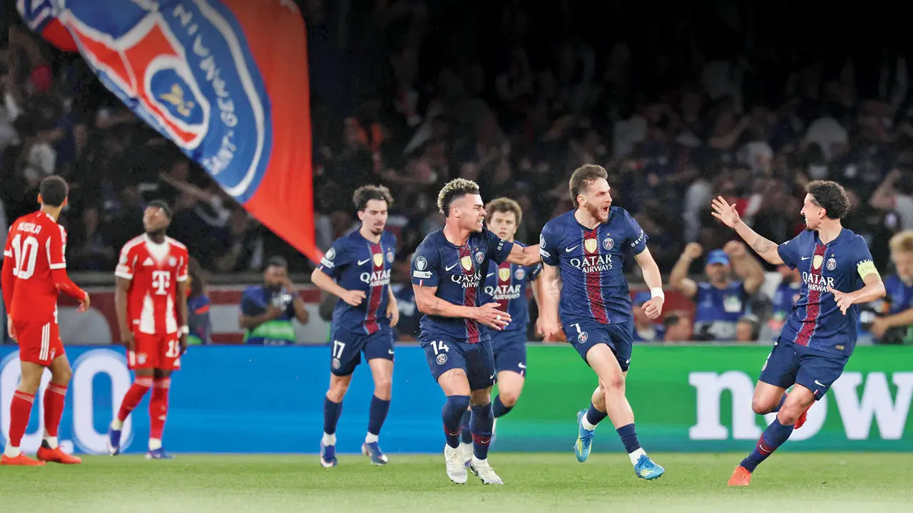 PSG’s Khvicha Kvaratskhelia (second from right) celebrates his goal against Bayern Munich with teammates in Paris on Tuesday. Pic/AFP