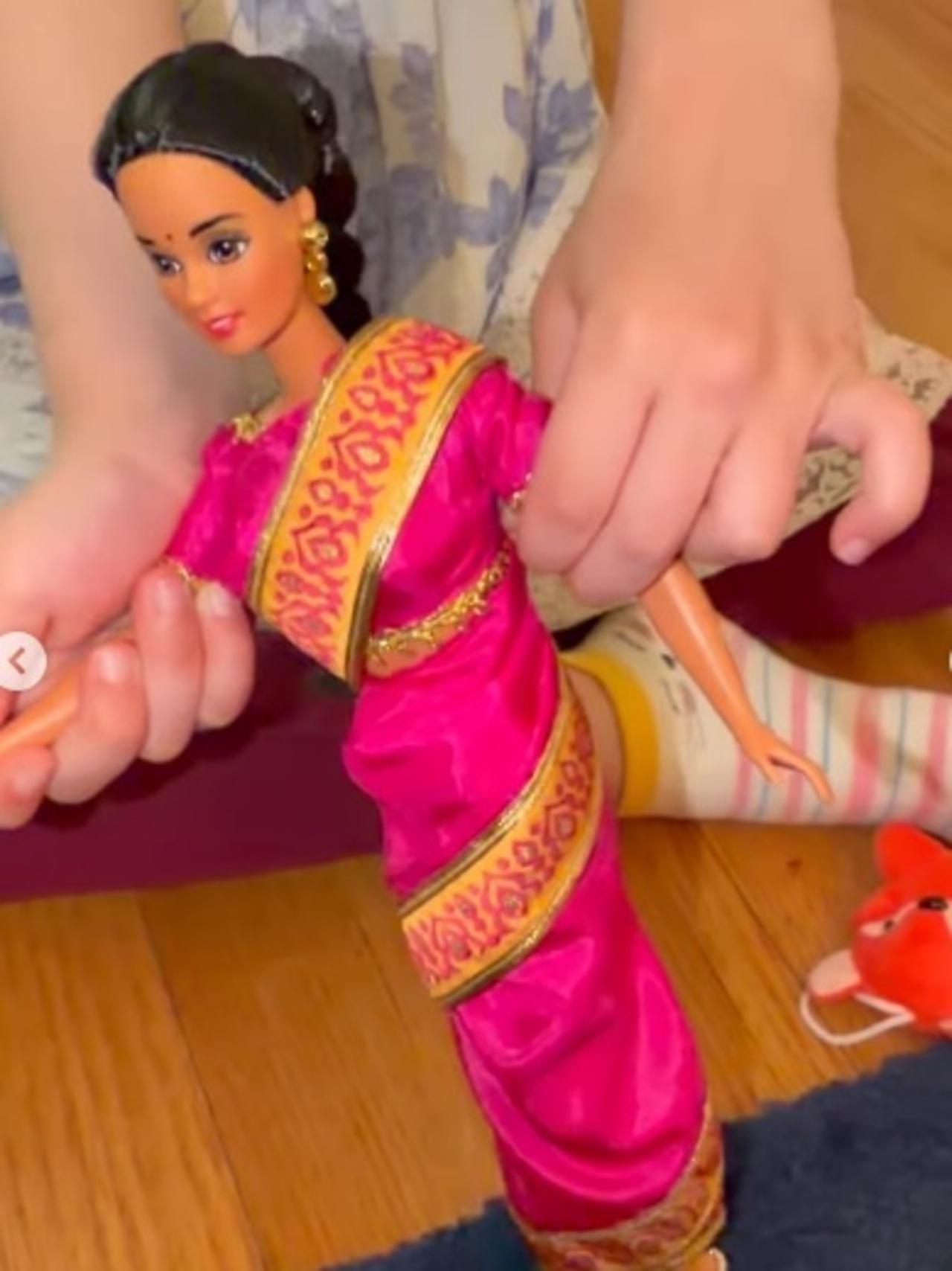 In another video, Preity's kid is seen playing with an Indian barbie dresses in a saree, and making it dance on Dhurandhar's latest song, &lsquo;Meinu Loot Leh Gaya