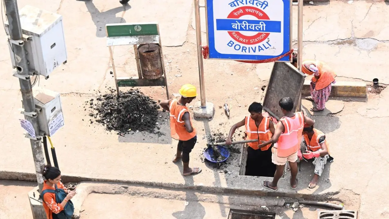 Mumbai gets monsoon-ready as workers clear soil and plastic waste from drains at Swami Vivekananda Road, Borivali West. PICS/ SATEJ SHINDE