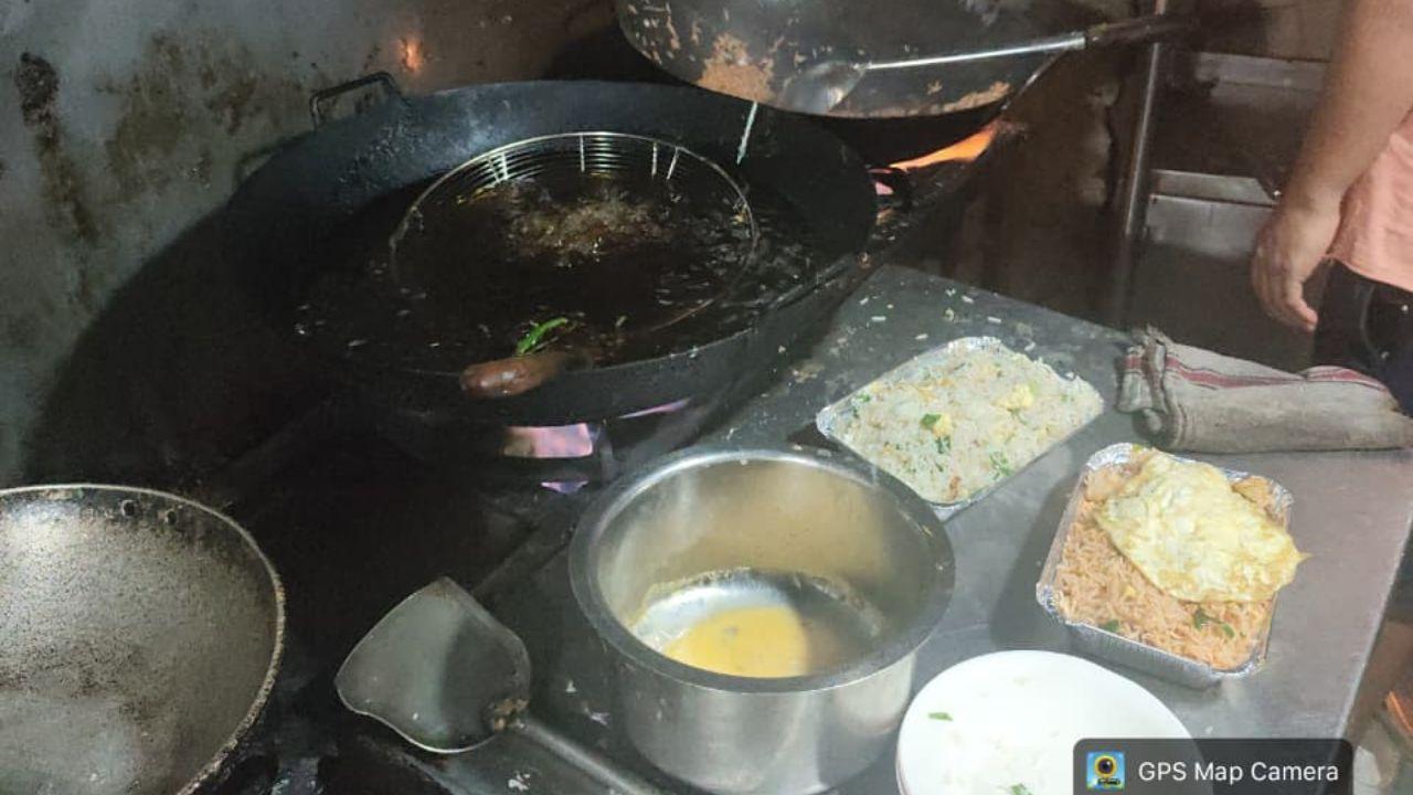 China Town Fast Food Centre in Mulund East faced immediate suspension after officers found excessive use of artificial colours and MSG, cockroach and insect infestation, cooked rice stored uncovered under a staircase in a damp, mouldy area, heavily rusted utensils, shared equipment for vegetarian and non-vegetarian food, and inadequate drainage leading to stagnant sewage and foul odour