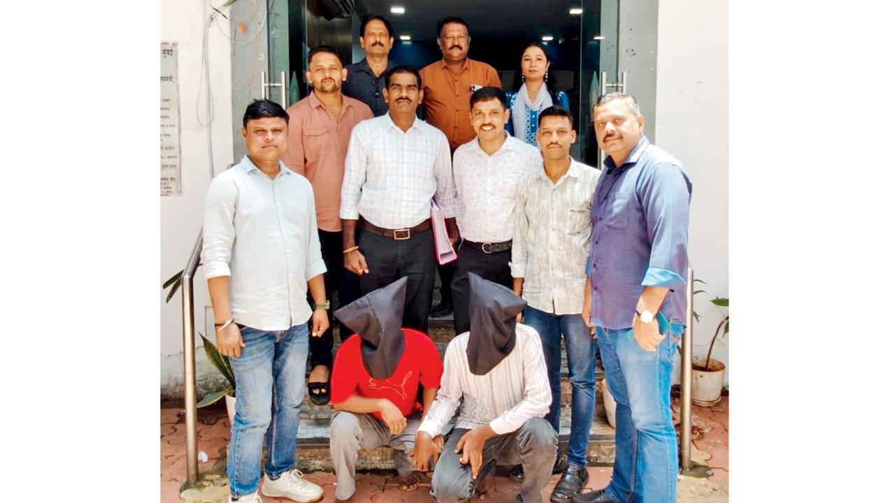 Mumbai cyber police bust WhatsApp impersonation racket South Cyber Police with the two arrested accused (in black hood). PIC/By Special Arrangement