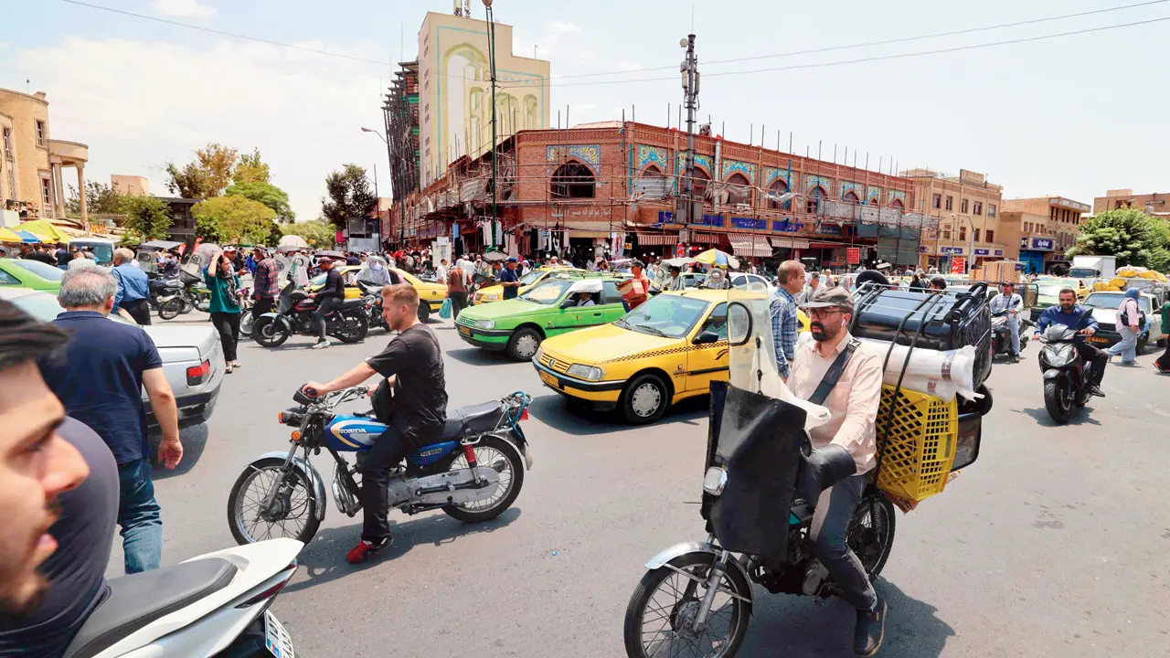 Trump pauses Iran strike amid push for nuclear deal Traffic drives past the area of the Grand Bazaar in Tehran. PIC/AFP