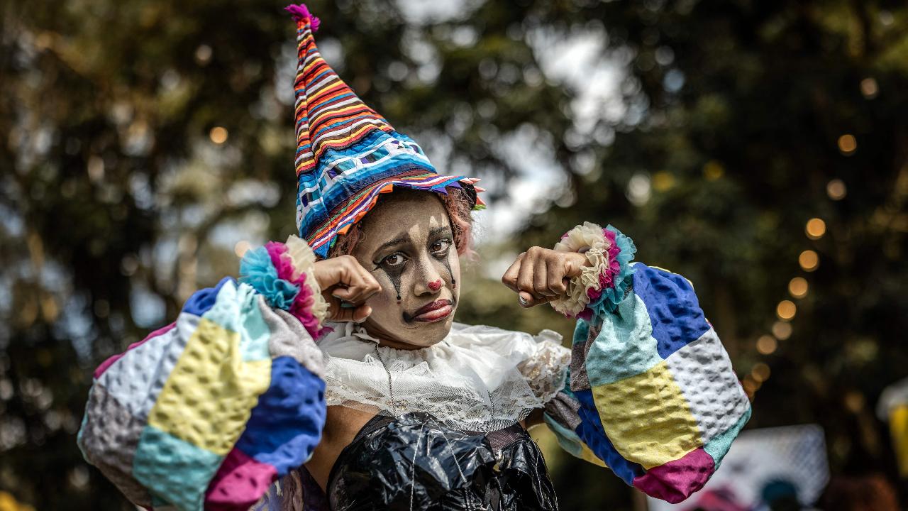 Among others, a fan dressed as a clown gestures during the Otamatsuri convention in Nairobi on August 22. Enthusiasm for the cosplay world is growing in Kenya, where more than 4,000 people attended the Otamatsuri convention in the capital on the day