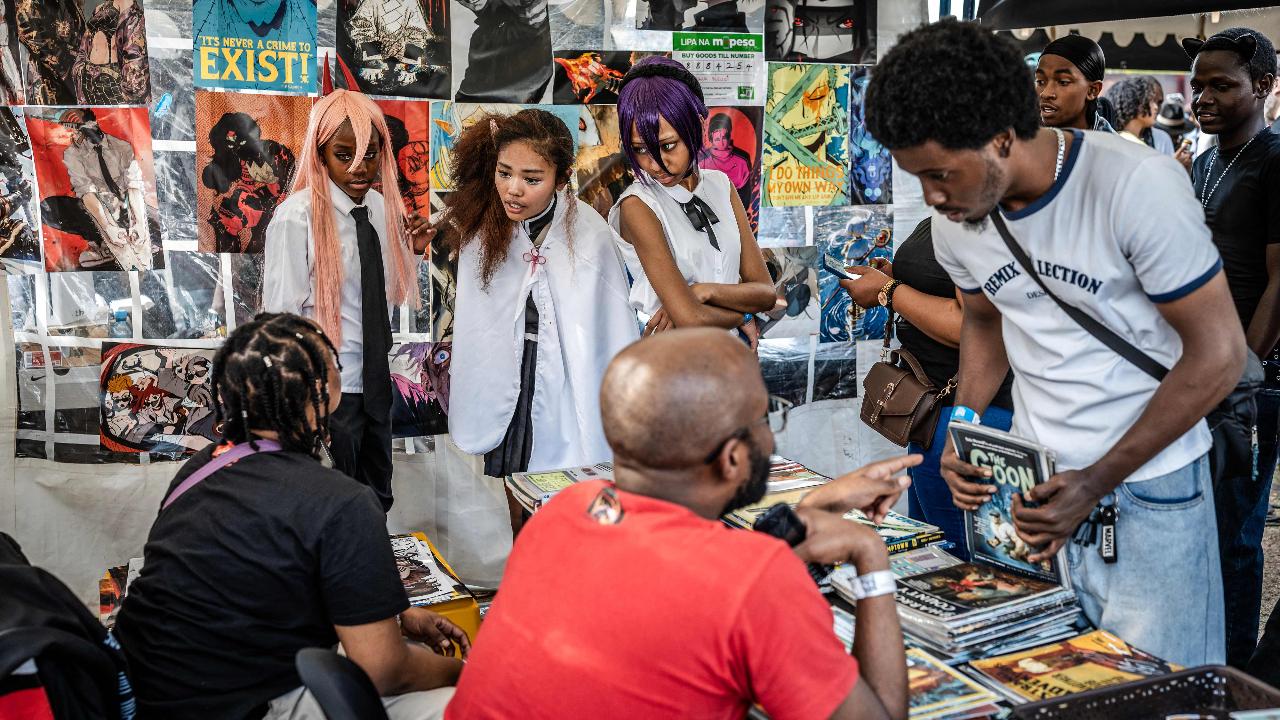 While there were cosplayer, manga and anime fans also browsed for comic books at a stall during the Otamatsuri convention in Nairobi on August 22, one of many anime conventions around the world