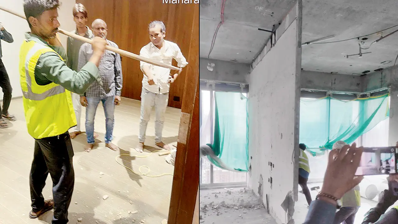 Civic workers raze constructions in apartments housed in two towers of the Rustomjee Crown housing complex in Prabhadevi on Tuesday. Pics/By Special Arrangement