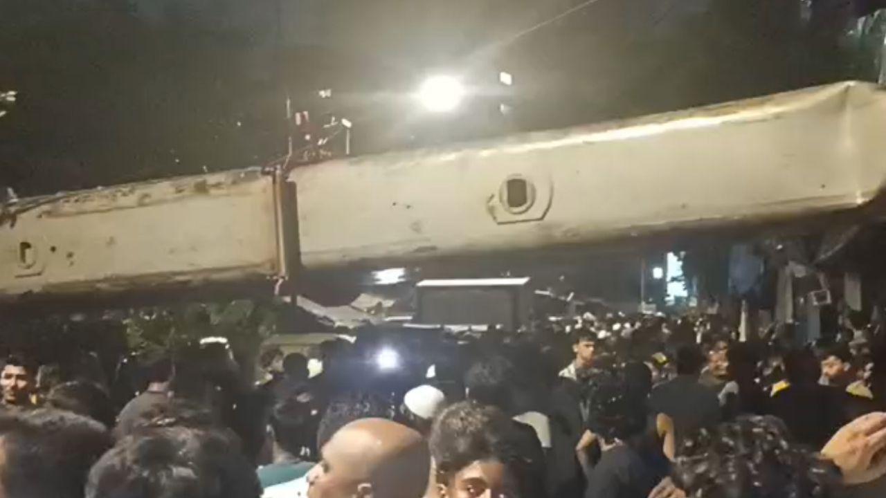 Kurla crane accident: 10 injured after hydraulic crane collapses onto railway overhead wires, huts in Qureshi Nagar slum Two injured after MMRDA crane falls on railway overhead equipment (Pic/Special arrangement)