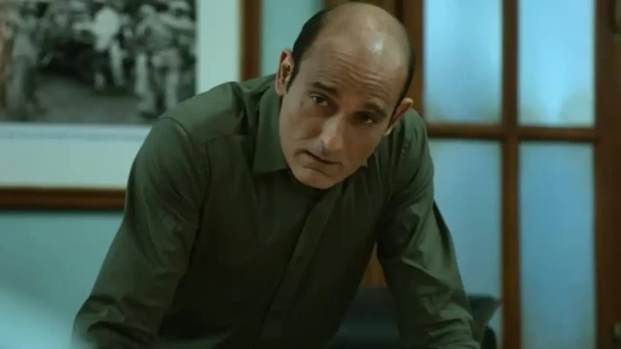 IG Tarun Ahlawat &ndash; Drishyam 2 (2022)
In Drishyam 2, Akshaye Khanna played IG Tarun Ahlawat, a sharp and determined police officer. He adopted a distinguished salt-and-pepper look, along with the imposing police uniform, to establish the character&rsquo;s authority. His restrained expressions and measured body language reflected an investigator who remains focused on uncovering the truth. Rather than relying on an extreme physical transformation, Khanna used styling, posture and mannerisms to create a believable senior police officer.