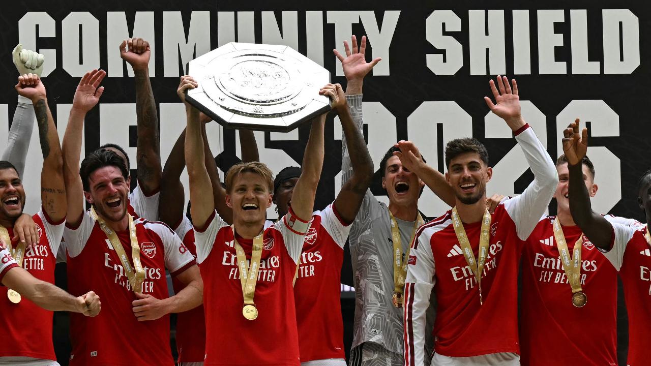 Arsenal team with the Community Shield (Pic: AFP)