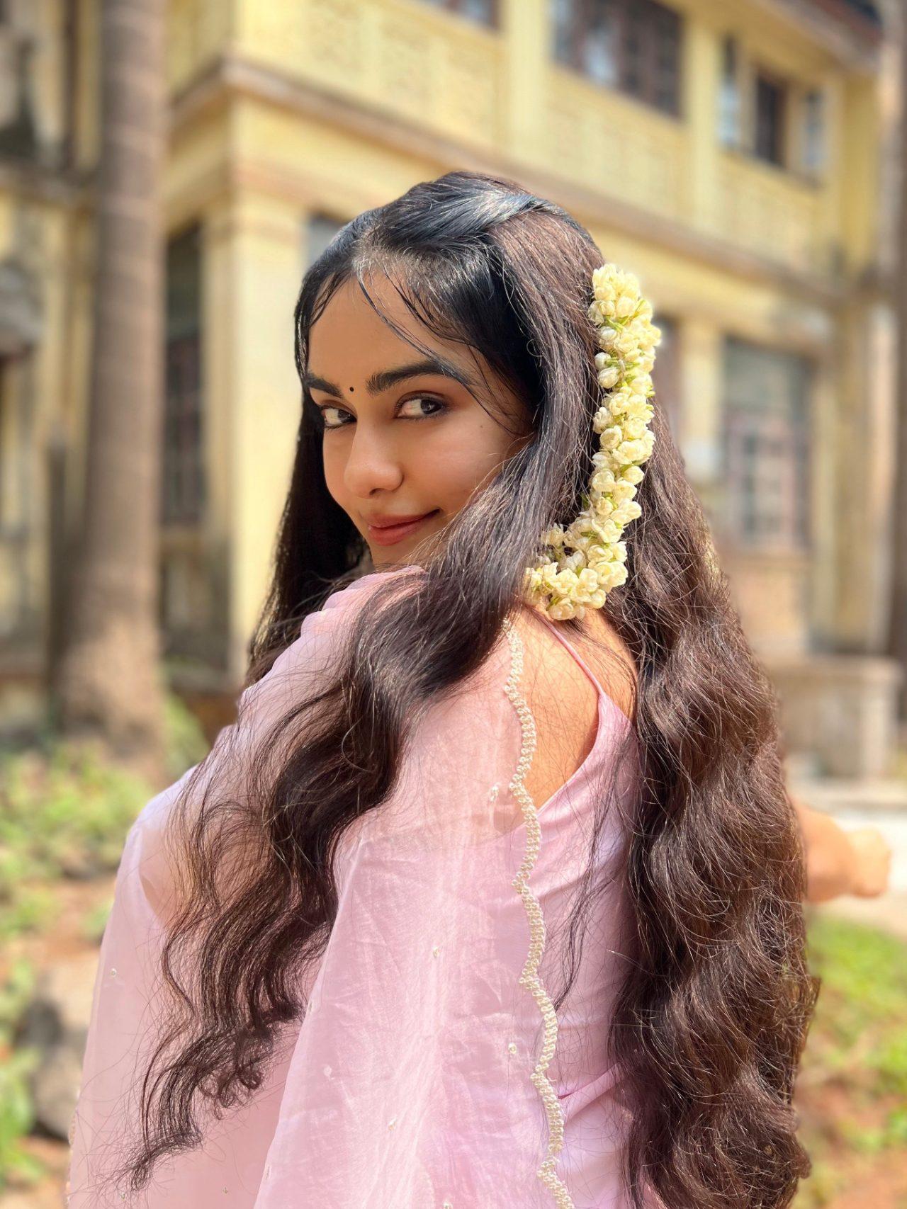 Adah Sharma looks effortlessly graceful in a pastel pink ensemble as she enjoys a festive Sadya meal, beautifully capturing the joy and warmth of Onam celebrations.