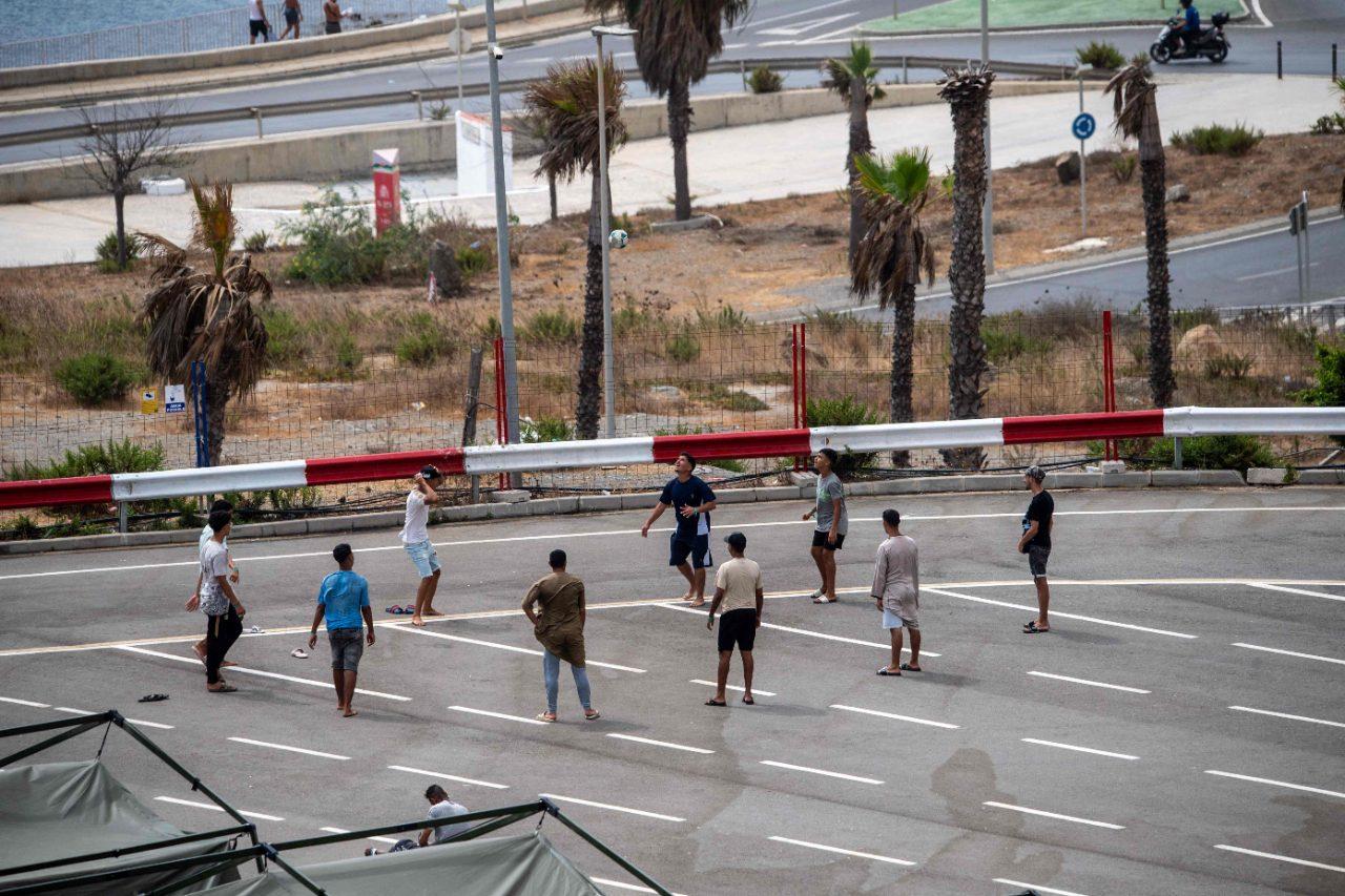 Migrants gather at a beach in Ceuta amid heightened tensions and growing concerns among local residents Migrants gather at a beach in Ceuta amid heightened tensions and growing concerns among local residents