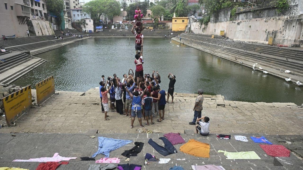 The festival, celebrated a day after Janmashtami, sees Govinda teams compete to break a suspended earthen pot filled with curd and other offerings, with human pyramids formed to reach the handi