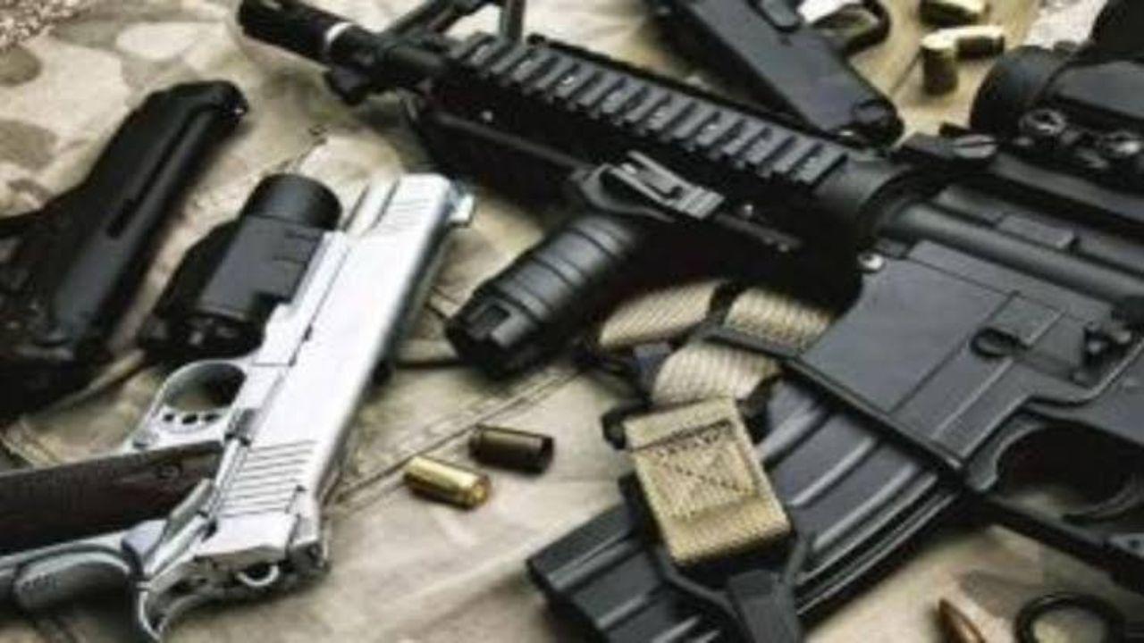 Militant arrested, large cache of arms seized in twin operations