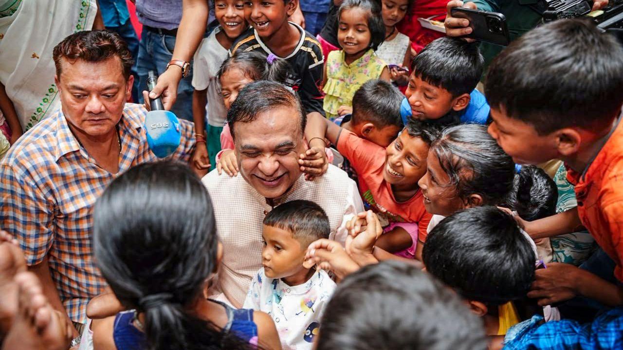 Himanta Sarma tours flood-hit Assam districts, assures relief and rehabilitation Assam Chief Minister Himanta Biswa Sarma shares a light moment with children during a meeting with flood-affected people at a relief camp..(PICS/PTI)