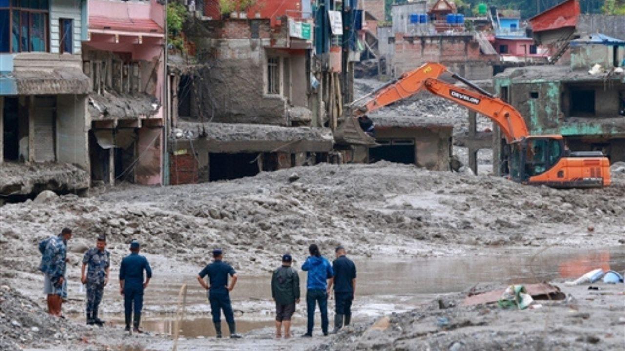 Residents travel towards flood-hit areas to assess damaged roads and check on villages that remain cut off following the flash floods Residents travel towards flood-hit areas to assess damaged roads and check on villages that remain cut off following the flash floods