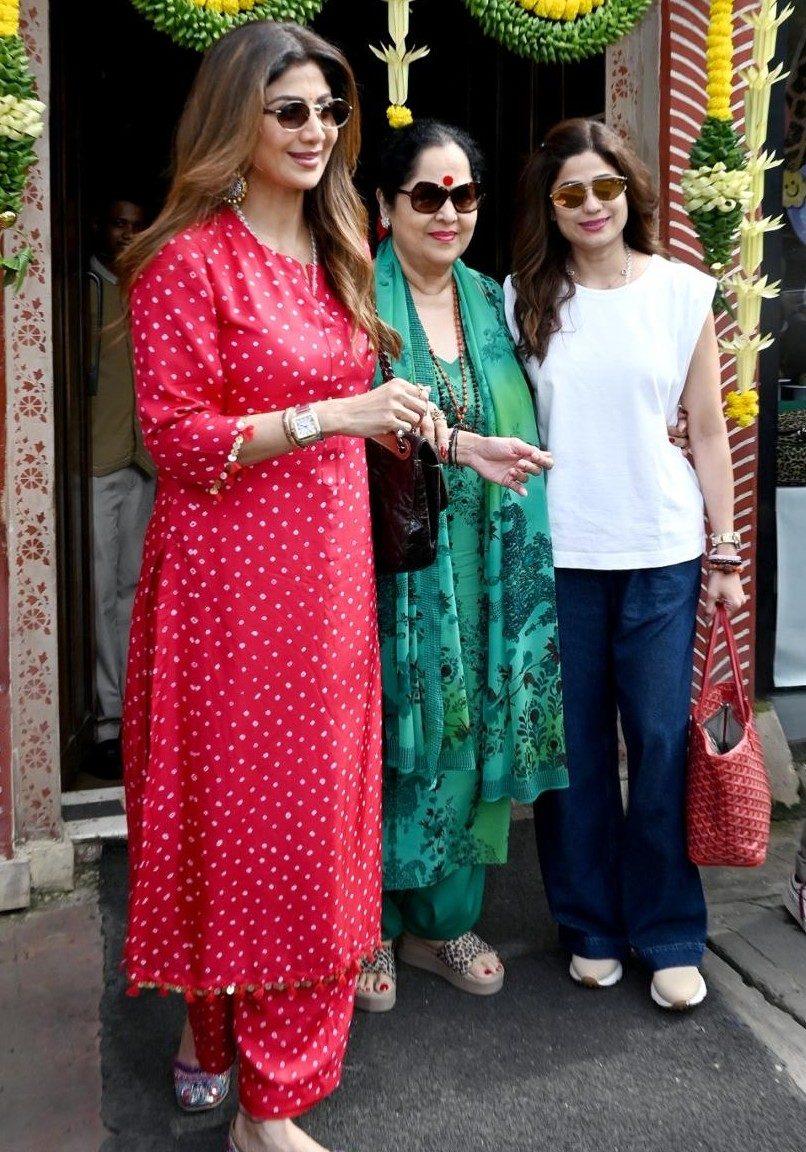 Shilpa Shetty was spotted celebrating the festive occasion with her mother and sister Shamita Shetty. The actress looked radiant in a bright red suit.
