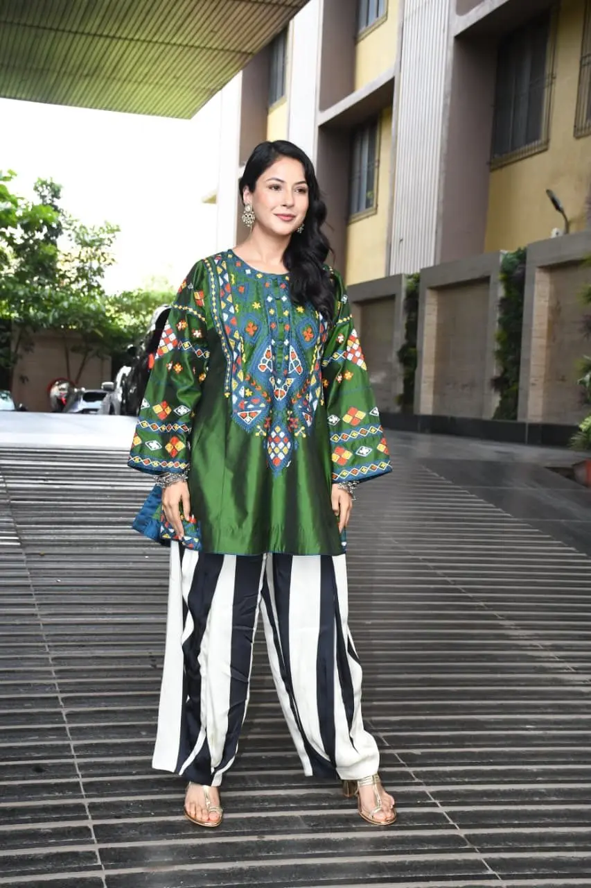 Shehnaaz Gill was seen in a green printed kurta with black and white palazzo pants as she stepped out in the city.
