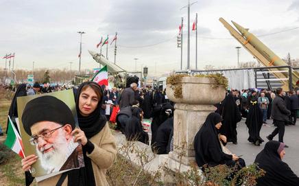 A participant holds a portrait of Iranian Supreme Leader Ayatollah Ali Khamenei at the Tehran rally. Pics/AFP