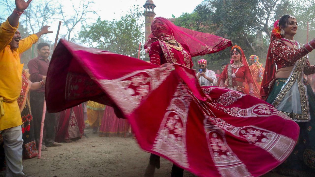 <p>Dressed in traditional attire, women participate in the joyous Lathmar Holi celebrations in Banaras, Uttar Pradesh</p> <p>Dressed in traditional attire, women participate in the joyous Lathmar Holi celebrations in Banaras, Uttar Pradesh</p>