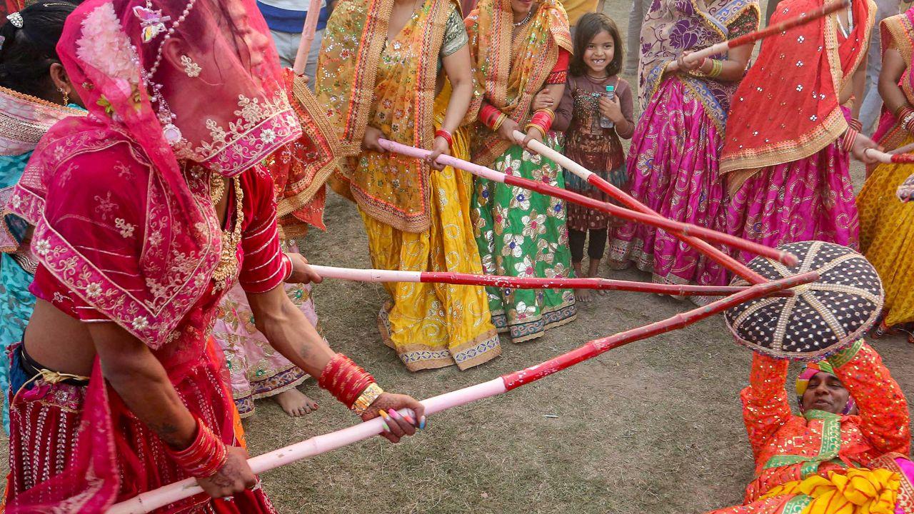 <p>Thousands of devotees and tourists throng Barsana to witness the vibrant Lathmar Holi festival rooted in the legend of Radha and Krishna</p> <p>Thousands of devotees and tourists throng Barsana to witness the vibrant Lathmar Holi festival rooted in the legend of Radha and Krishna</p>