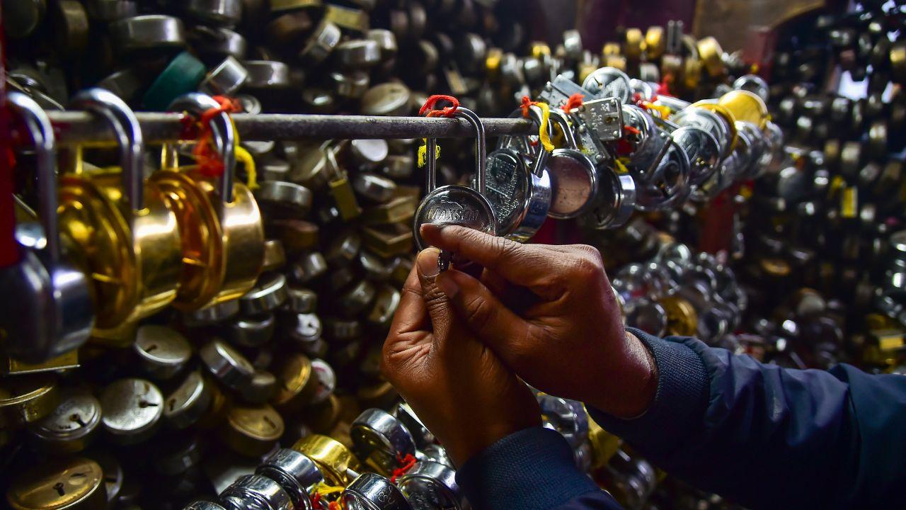 <p>A person performs a ritual of locking a padlock to make a wish at the `Nageshwar Nath Mahadev` temple ahead of the `Mahashivratri` festival</p> <p>A person performs a ritual of locking a padlock to make a wish at the `Nageshwar Nath Mahadev` temple ahead of the `Mahashivratri` festival</p>