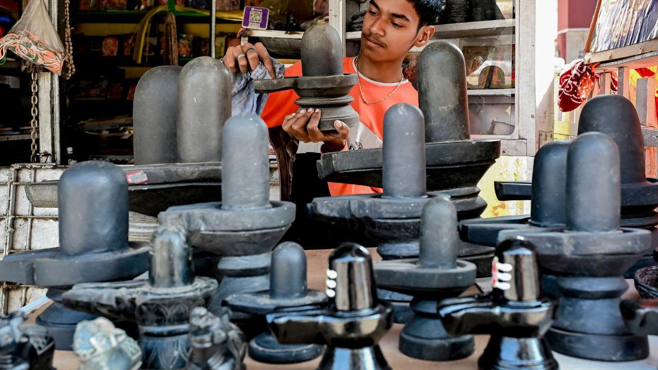 <p>A vendor displays `shivlings` along with ceremonial objects in a shop ahead of the `Mahashivratri` festival, in Nadia, West Bengal</p> <p>A vendor displays `shivlings` along with ceremonial objects in a shop ahead of the `Mahashivratri` festival, in Nadia, West Bengal</p>