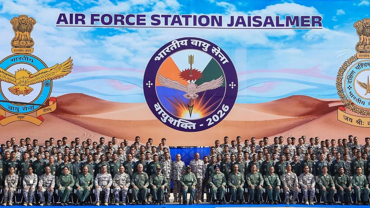 President Droupadi Murmu, centre, with Chief of the Air staff Air Chief Marshal AP Singh, and others, poses for photographs after undertaking a sortie in the HAL Light Combat Helicopter 'Prachand' at Air Force Station, in Jaisalmer