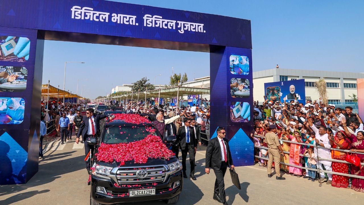 Prime Minister Narendra Modi waves to supporters upon arriving in Sanand, Gujarat, for the inauguration of Micron Technology’s semiconductor facility
