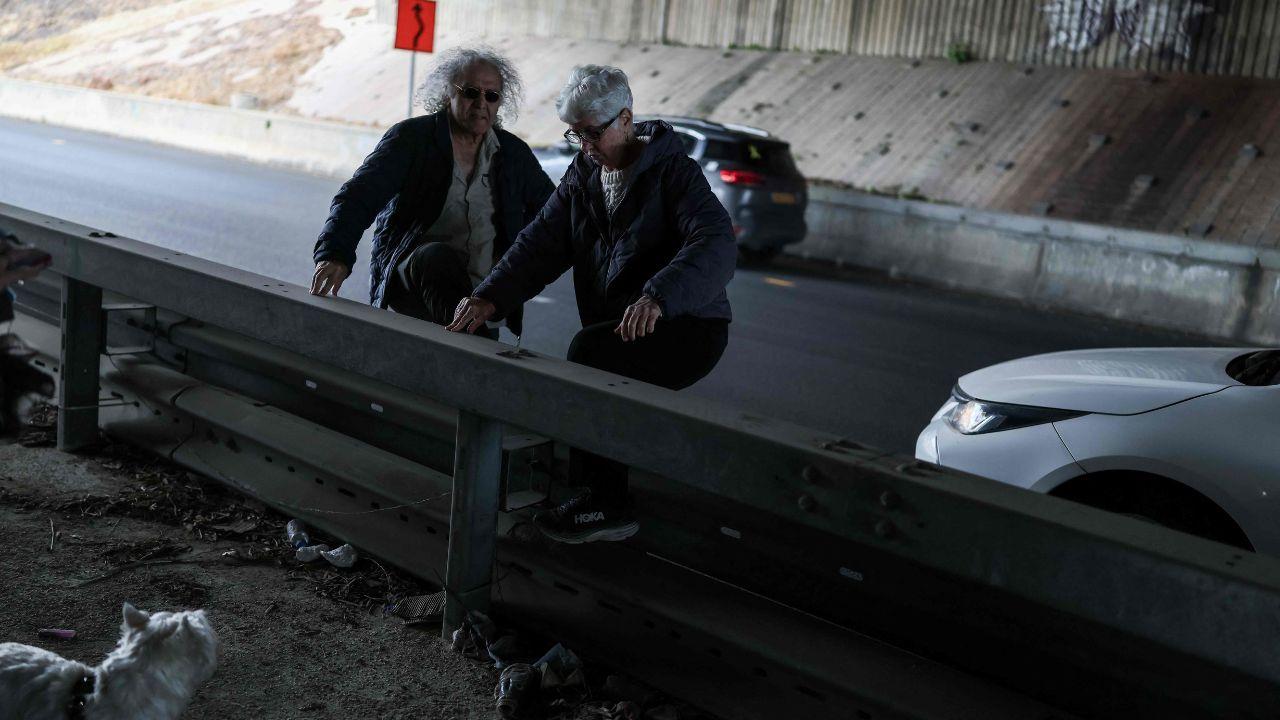 Some residents shelter under a bridge near Tel Aviv, demonstrating the immediate impact of US-Israel strikes on Iran and Iran’s retaliatory missile attack threats