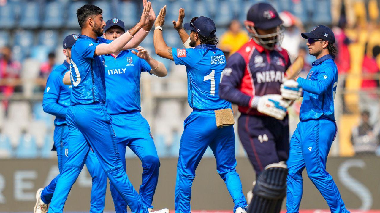 Italy’s bowlers celebrate the breakthrough, as Crishan Kalugamage leads a disciplined bowling effort to restrict Nepal to 123