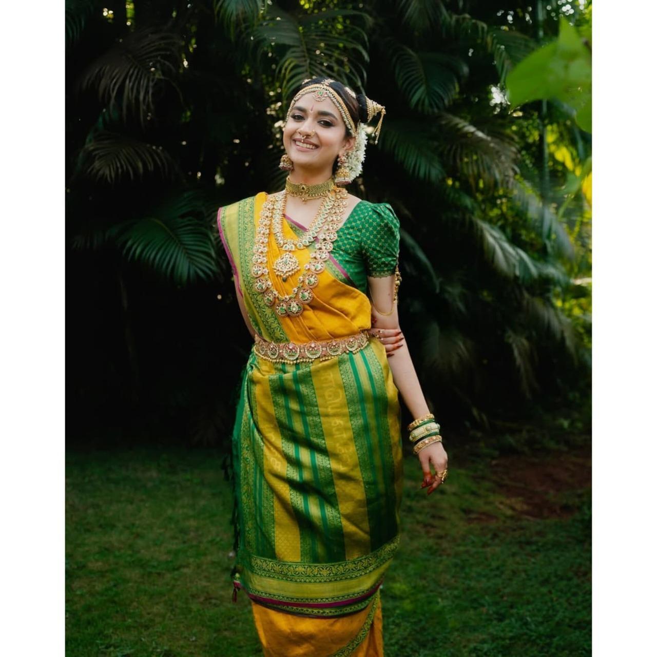 Keerthy Suresh and Antony Thattil embraced their cultural roots by marrying in a traditional Tamil Brahmin Iyengar ceremony. Keerthy donned the elegant madisar, a nine-yard sari draped in the Iyengar kattu style. Keerthy’s bridal look was accentuated by traditional Bharatanatyam jewellery.