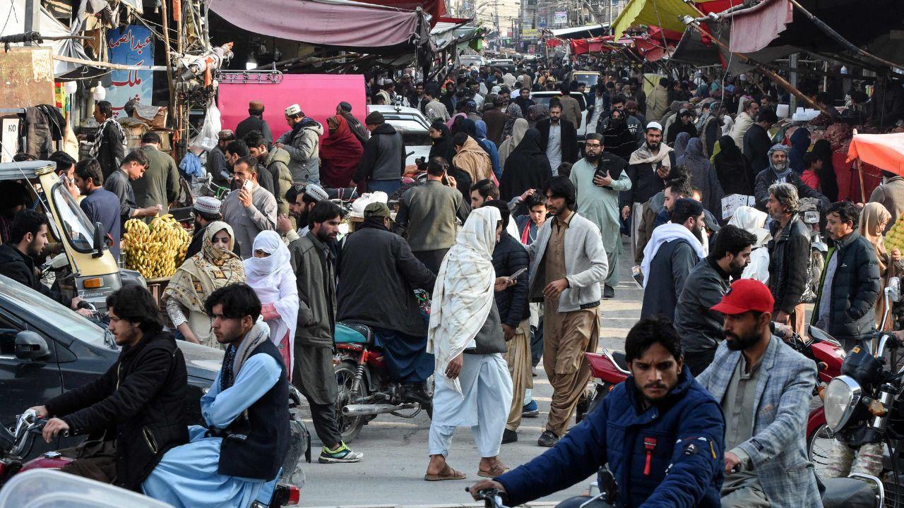 Shoppers crowd a bustling marketplace in Quetta, gathering essential food items as anticipation builds for the holy month